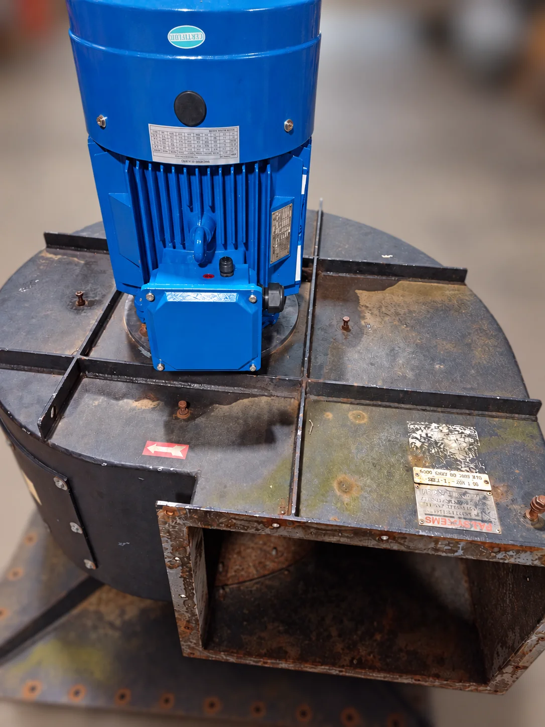 Replacement blue motor fitted to the existing black extractor casing