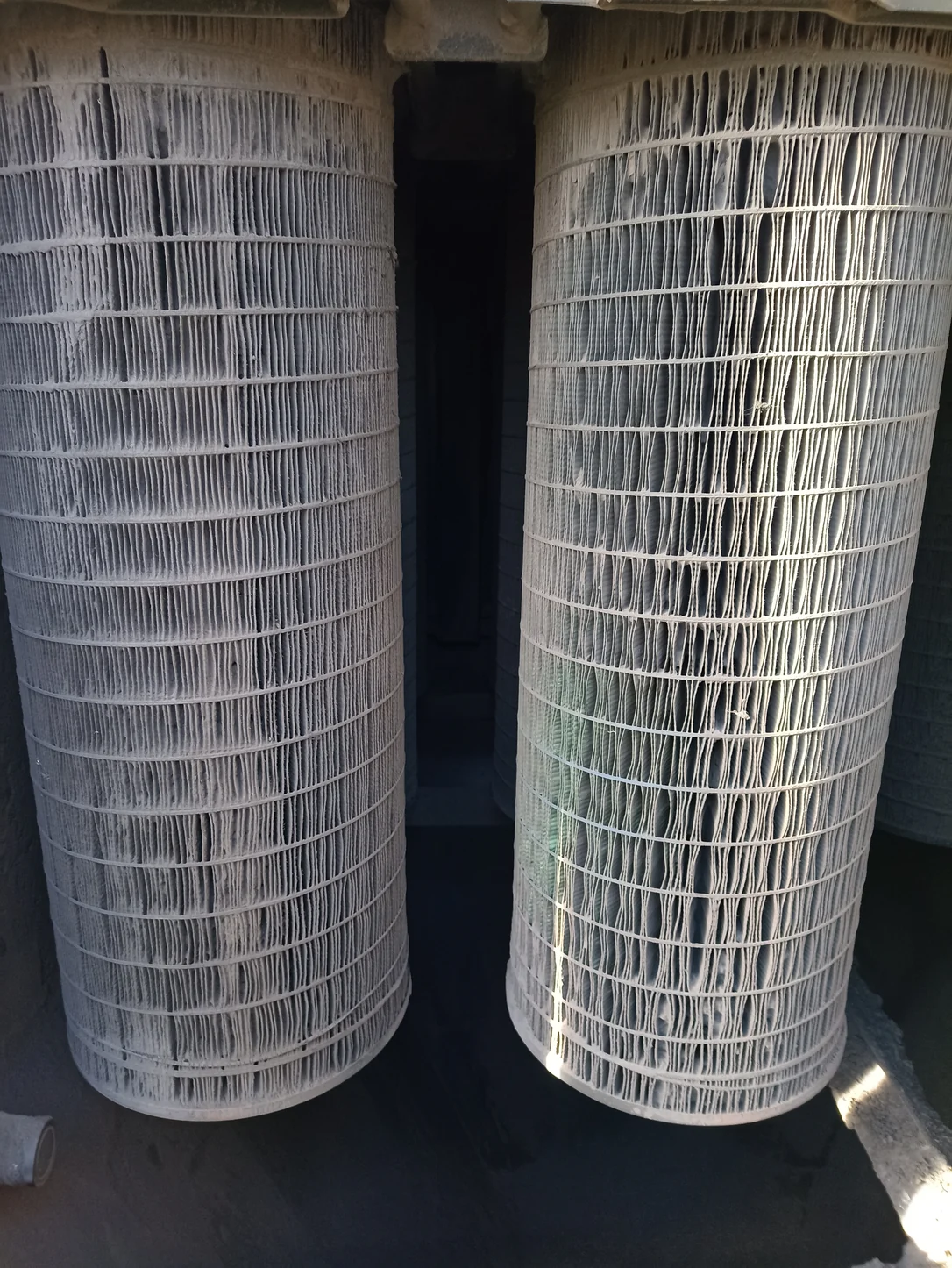 Used filter cartridges inside the silica-sand extractor before replacement